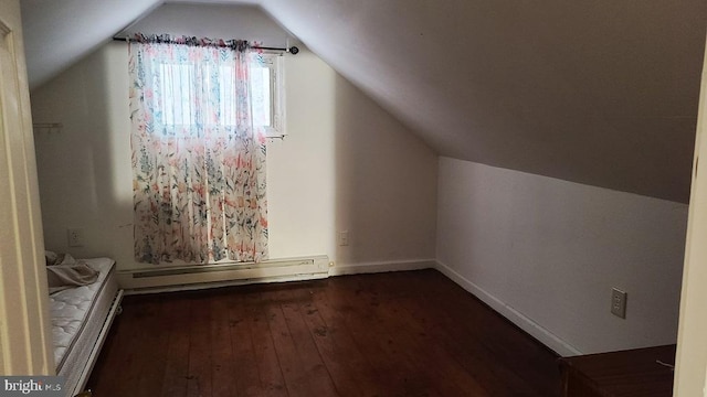 bonus room with dark hardwood / wood-style flooring, a baseboard radiator, and lofted ceiling