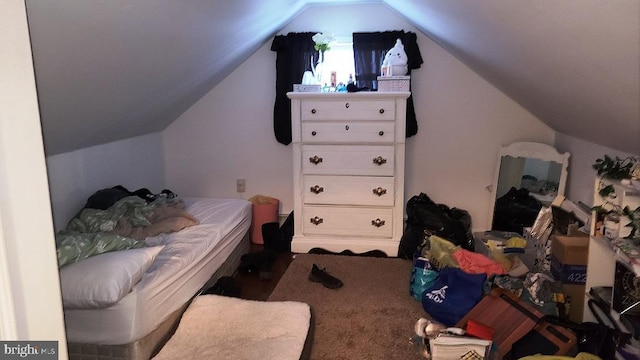 bedroom featuring lofted ceiling