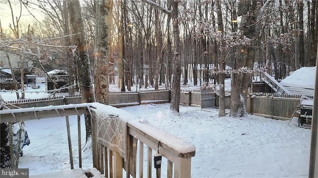 view of yard layered in snow