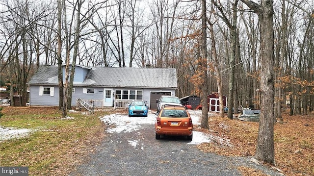 view of front of home with a storage unit