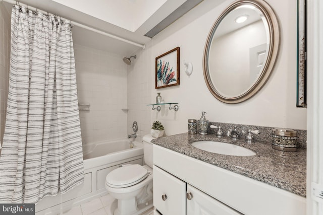 bathroom featuring tile patterned floors, shower / tub combo with curtain, toilet, and vanity