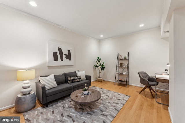 living room featuring recessed lighting, baseboards, and wood finished floors