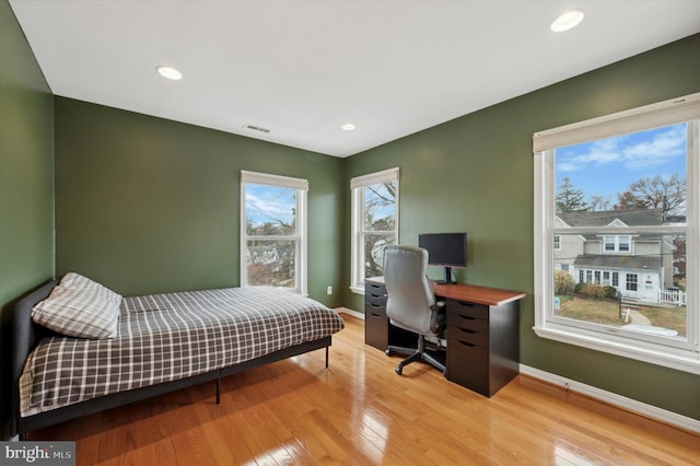 bedroom with light wood-type flooring