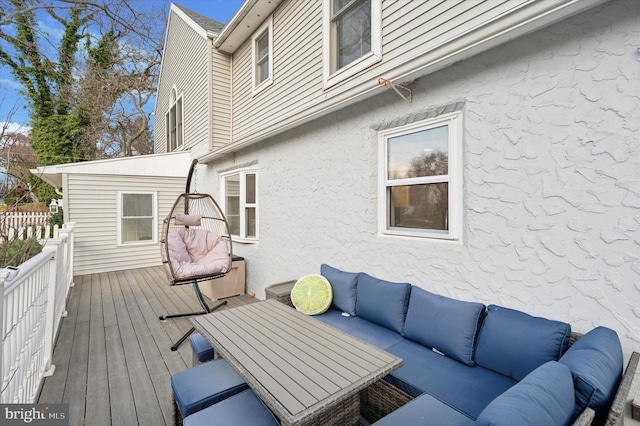 wooden deck with an outdoor hangout area