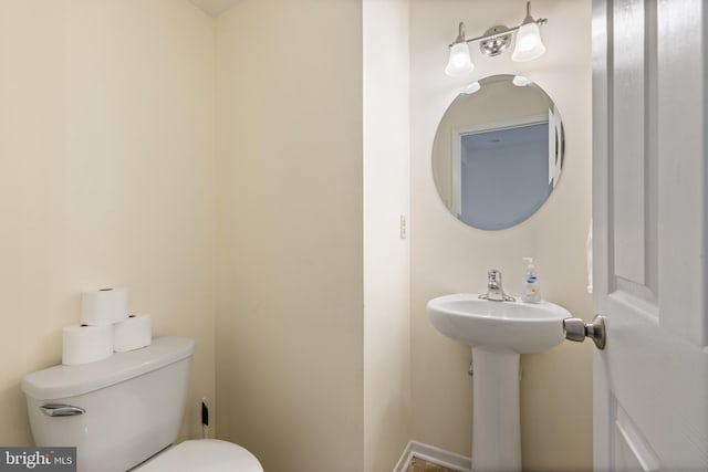 bathroom with toilet and sink