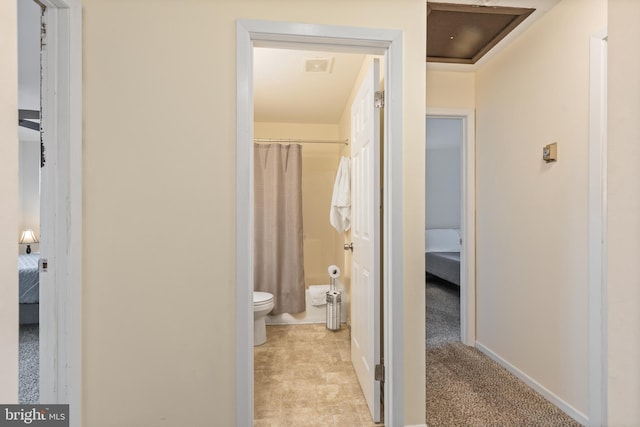 bathroom featuring shower / bath combo and toilet