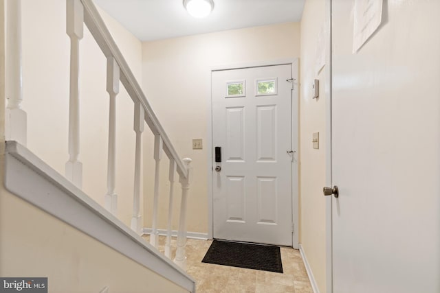 276 Broad St, Highspire, PA 17034 - foyer featuring stairway and baseboards