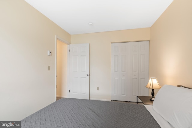 carpeted bedroom with a closet