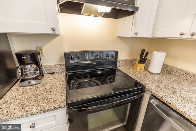 kitchen featuring white cabinets, light stone countertops, black / electric stove, and exhaust hood