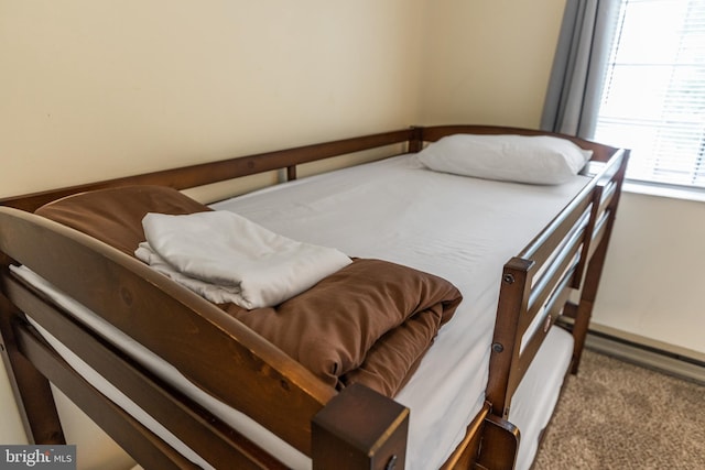 bedroom featuring light colored carpet