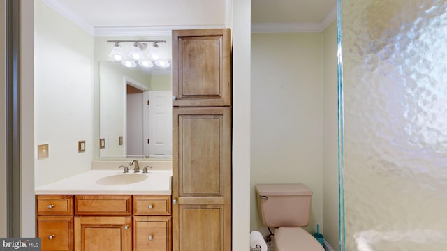 bathroom featuring vanity, toilet, and ornamental molding