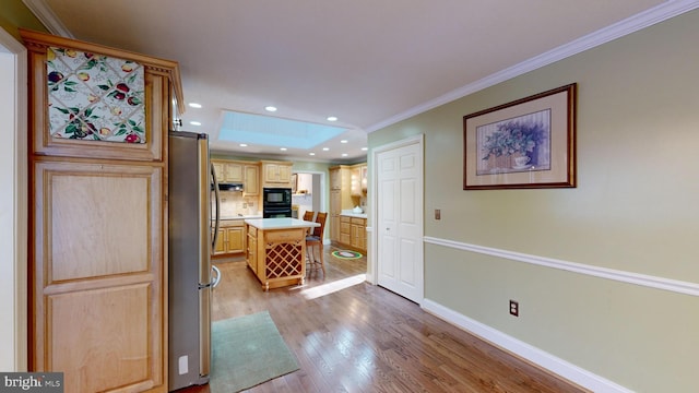 corridor with crown molding and light wood-type flooring