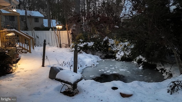 view of yard covered in snow