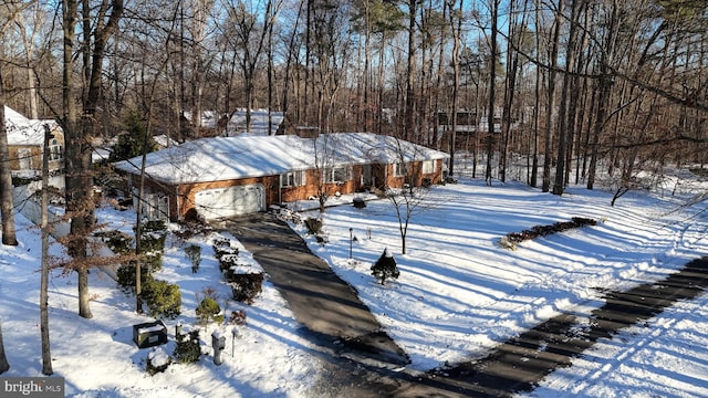 yard covered in snow with a garage