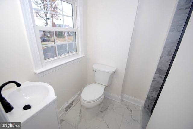 bathroom with sink and toilet