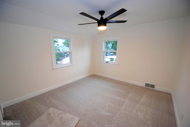 unfurnished room featuring ceiling fan and light colored carpet