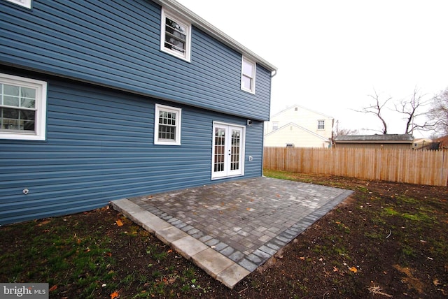 back of house featuring a patio area and french doors