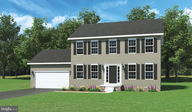 colonial house featuring a garage and a front yard