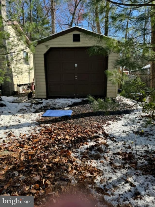 view of snow covered garage