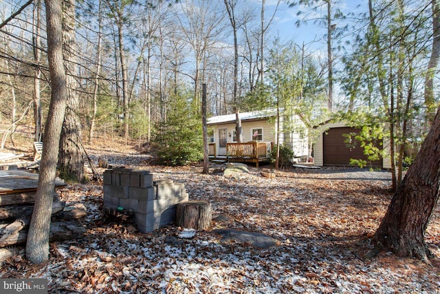 view of yard with a wooden deck