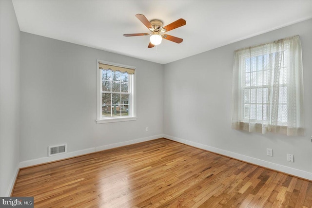 unfurnished room with ceiling fan and light hardwood / wood-style flooring