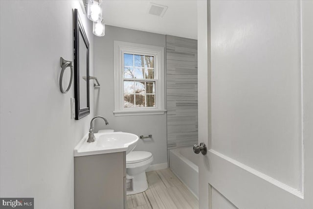 full bathroom featuring vanity, toilet, and shower / washtub combination