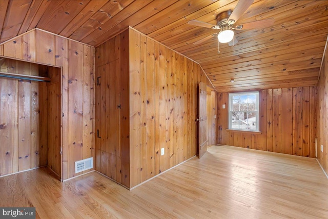 bonus room featuring lofted ceiling, light hardwood / wood-style flooring, and wooden ceiling