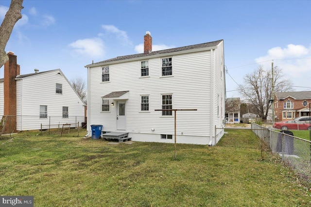 back of house with a yard