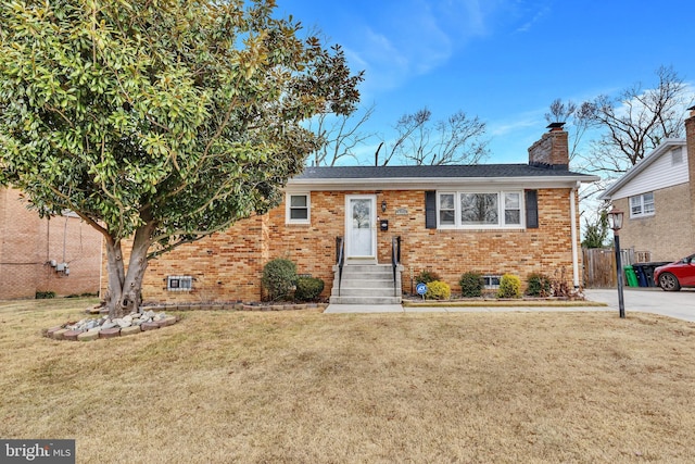 view of front of home with a front lawn