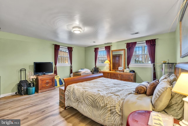 bedroom with light wood-type flooring