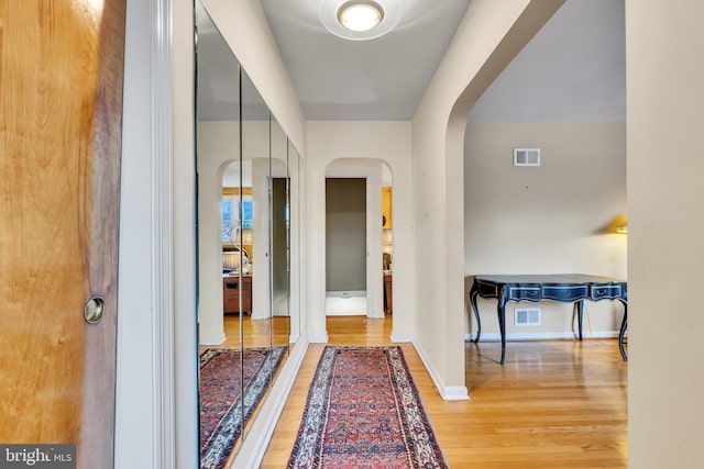 hallway featuring wood-type flooring