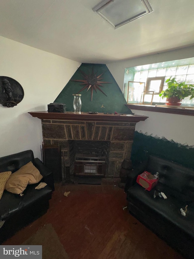 living room with a fireplace and hardwood / wood-style floors