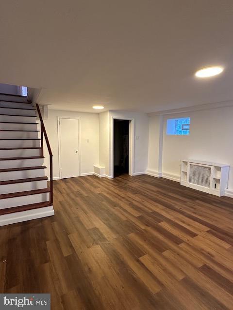 basement featuring dark wood-type flooring