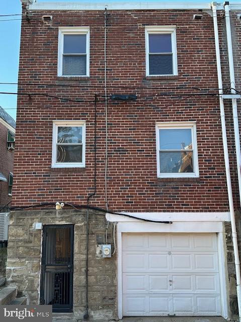 view of side of property with a garage