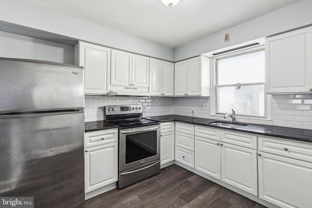 kitchen featuring white cabinetry, sink, dark wood-type flooring, and appliances with stainless steel finishes