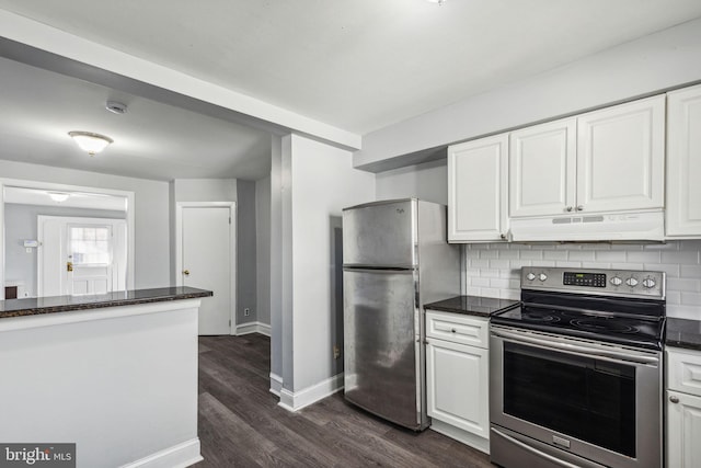 kitchen featuring white cabinets, extractor fan, and appliances with stainless steel finishes