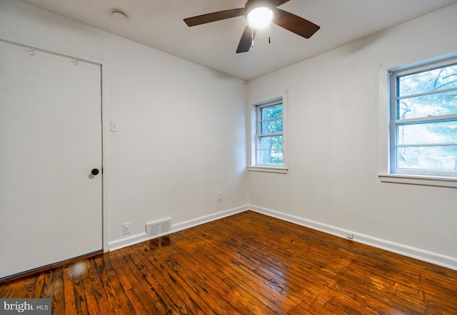 spare room featuring hardwood / wood-style floors and ceiling fan