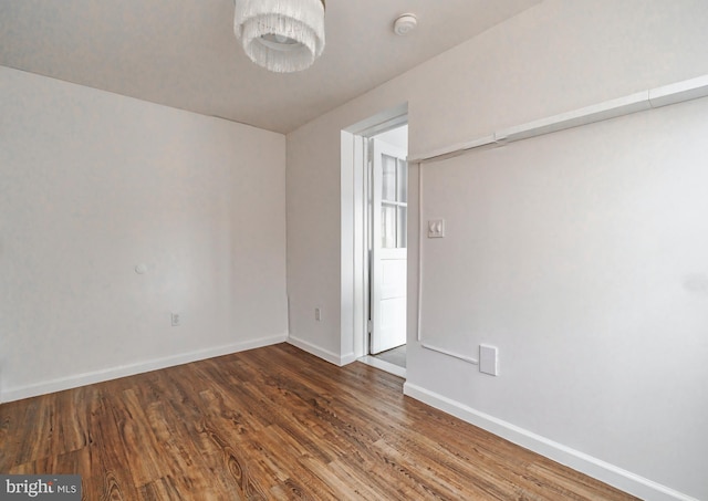 unfurnished room featuring dark hardwood / wood-style floors