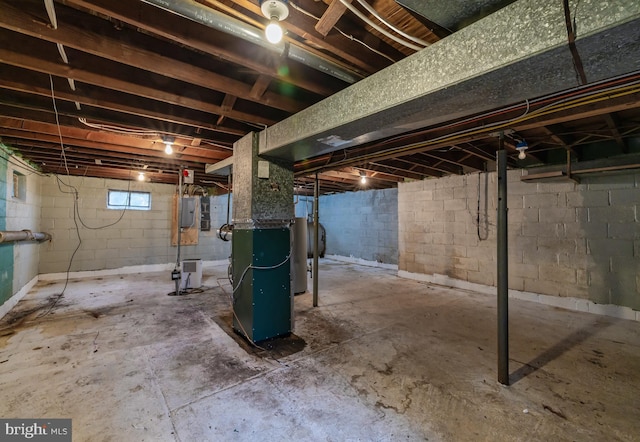 basement with electric panel and heating unit