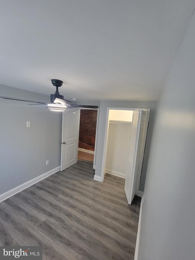 interior space featuring hardwood / wood-style floors and ceiling fan