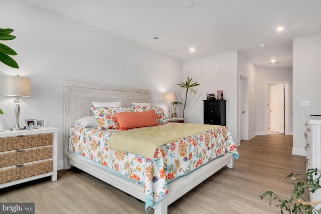 bedroom with light hardwood / wood-style floors