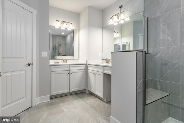 bathroom featuring vanity and an enclosed shower