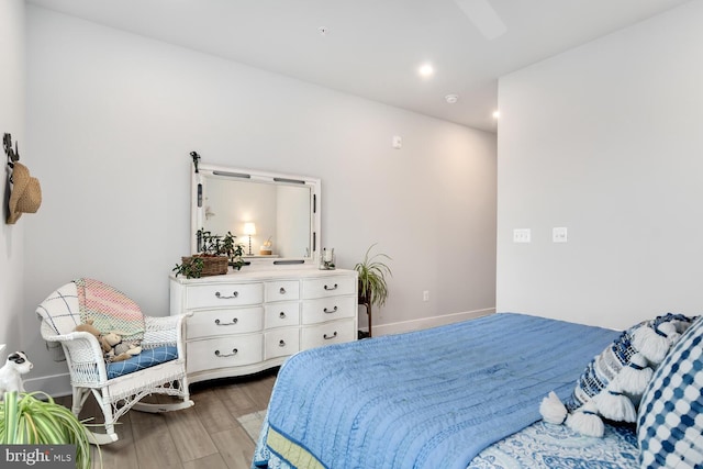 bedroom featuring ceiling fan and wood-type flooring