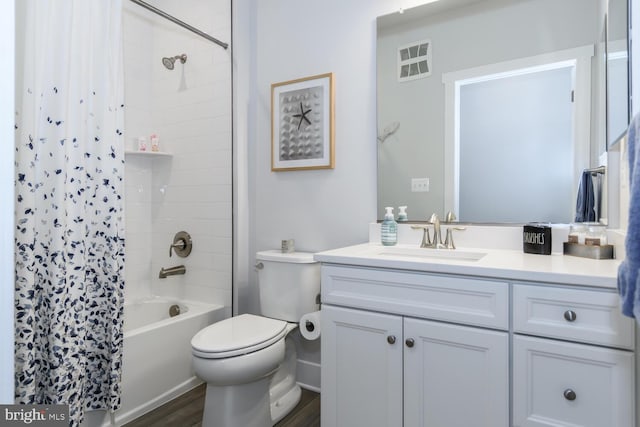 full bathroom with hardwood / wood-style flooring, vanity, toilet, and shower / bathtub combination with curtain