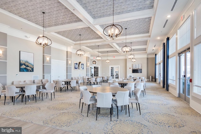 dining space with french doors, coffered ceiling, light wood-type flooring, a towering ceiling, and beam ceiling