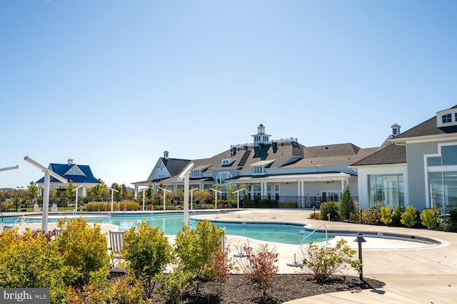 view of swimming pool featuring a patio