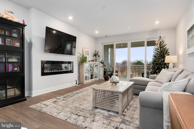 living room with dark hardwood / wood-style floors