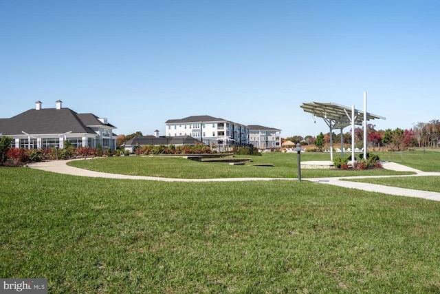 view of property's community featuring a lawn