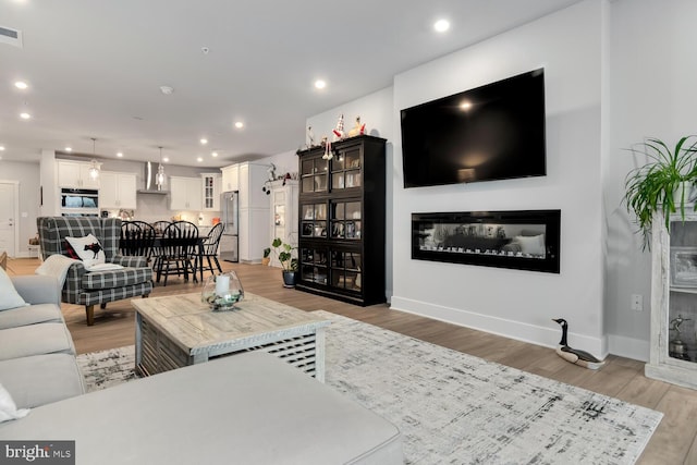 living room with hardwood / wood-style flooring