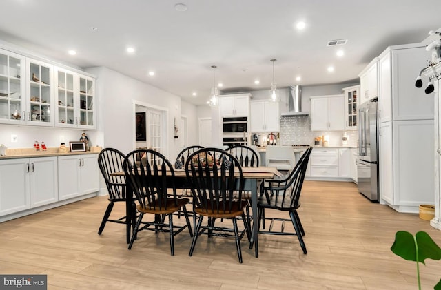 dining room with light wood-type flooring